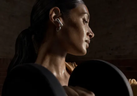 Apple AirPods 5 with charging case showing the new open-ear design and ANC earbuds